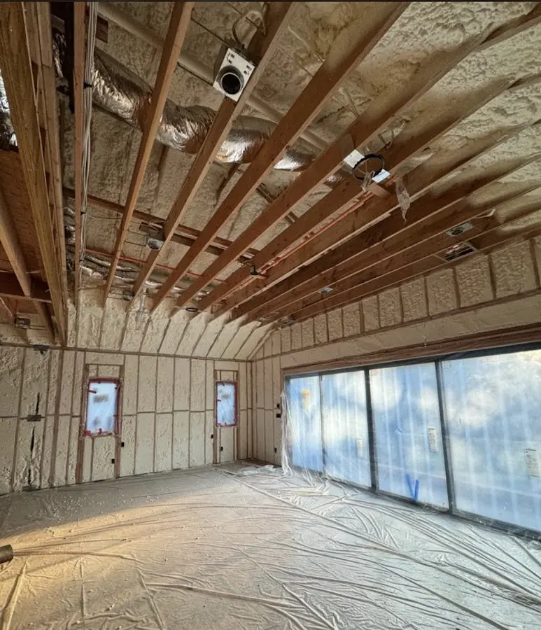Interior walls and ceiling insulated with spray foam during new construction in East Cleveland